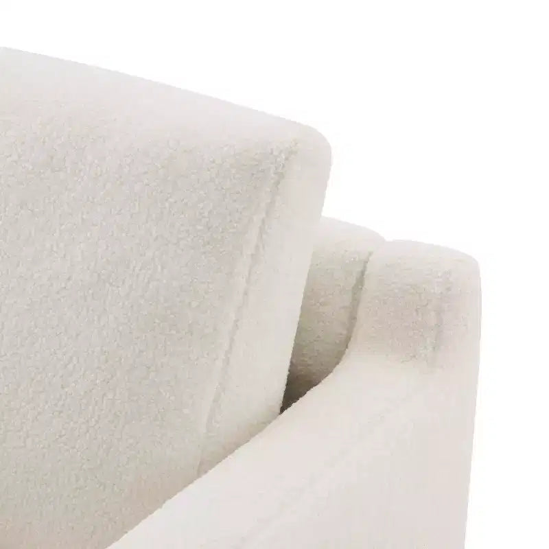 Poltrona moderna Niran in legno di gomma con rivestimento in bouclé e morbido cuscino