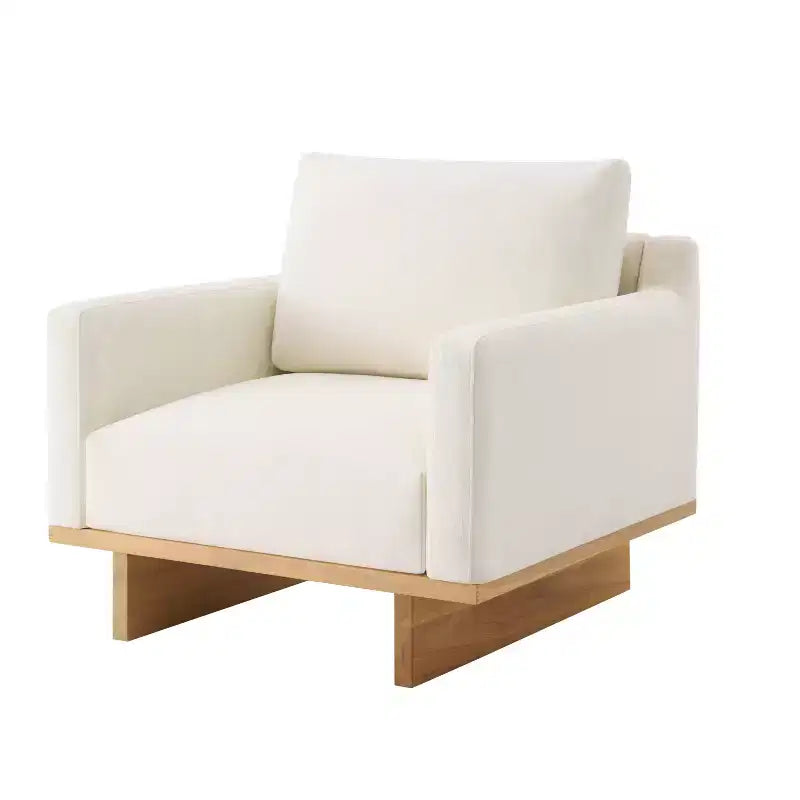 Poltrona moderna Niran in legno di gomma con rivestimento in bouclé e morbido cuscino